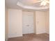 Bedroom showcasing double-door closet, neutral walls, plush carpet, and a ceiling fan at 2507 Princewood St, Raleigh, NC 27612