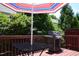 Cozy deck with a grill, umbrella, and seating area for outdoor enjoyment at 2507 Princewood St, Raleigh, NC 27612