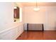 Bright dining room with hardwood floors, wainscoting, and modern lighting at 2507 Princewood St, Raleigh, NC 27612