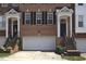 Attractive brick townhome exterior with garage and welcoming front entrance at 2507 Princewood St, Raleigh, NC 27612