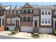 Charming brick townhomes with private garages and inviting front entrances at 2507 Princewood St, Raleigh, NC 27612