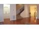 Foyer with hardwood floors, staircase, and view into other rooms at 2507 Princewood St, Raleigh, NC 27612