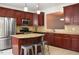 Spacious kitchen with stainless steel appliances, granite countertops, and island with seating at 2507 Princewood St, Raleigh, NC 27612