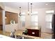 Bright kitchen boasts granite countertops, stainless steel appliances, and a functional center island at 2507 Princewood St, Raleigh, NC 27612