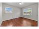 Bedroom with hardwood floors and windows providing natural light at 2512 Mckinney St, Burlington, NC 27217