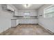 Classic kitchen with ample cabinet space and clean white appliances, ready for culinary creations at 2512 Mckinney St, Burlington, NC 27217