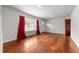 Well-lit living room with hardwood floors and a large window, offering a blank canvas for personalization at 2512 Mckinney St, Burlington, NC 27217