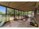 Relaxing screened porch, ideal for enjoying the outdoors in comfort and style at 2512 Mckinney St, Burlington, NC 27217