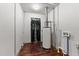 Utility room with water heater and access to the backyard at 2512 Mckinney St, Burlington, NC 27217