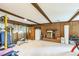 Finished basement featuring wood-paneled walls, fireplace and workout area at 2712 Pebblebrook Dr, Sanford, NC 27330