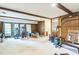 Spacious basement featuring exposed wood beams, paneling, and exercise equipment at 2712 Pebblebrook Dr, Sanford, NC 27330