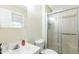 This bathroom has a glass shower door and a large mirror at 2712 Pebblebrook Dr, Sanford, NC 27330