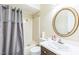 Neutral bathroom with a tub shower and dark wood vanity at 2712 Pebblebrook Dr, Sanford, NC 27330