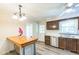 Well-lit kitchen featuring an island, stainless steel appliances, and a ceiling fan at 2712 Pebblebrook Dr, Sanford, NC 27330