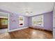 Bedroom featuring hardwood floors, natural light, and unique wall design at 2715 E Geer St, Durham, NC 27704