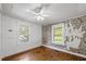 Bedroom with hardwood floors, natural light, and unique design elements at 2715 E Geer St, Durham, NC 27704