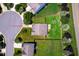 A home on a cul-de-sac featuring a spacious lawn with mature landscaping and close proximity to a neighborhood street at 305 Wallington Ct, Mebane, NC 27302