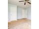 An empty bedroom featuring two doors and a ceiling fan at 305 Wallington Ct, Mebane, NC 27302