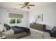 A staged bedroom featuring a large bed, dresser, chair, and rug on top of the original carpet at 305 Wallington Ct, Mebane, NC 27302