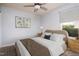 Rendered bedroom showcasing neutral decor, a ceiling fan, and bright natural light from the outdoor window at 305 Wallington Ct, Mebane, NC 27302