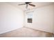 A simple bedroom with natural light through the window and a ceiling fan at 305 Wallington Ct, Mebane, NC 27302