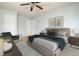 A staged bedroom featuring a large bed, dresser, chair, and rug at 305 Wallington Ct, Mebane, NC 27302