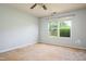 Empty bedroom featuring a ceiling fan and natural light, awaiting your personal touch to create a cozy retreat at 305 Wallington Ct, Mebane, NC 27302