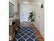 Stylishly staged hallway with wood floors, decorative rug, and console table, enhancing the home's appeal at 305 Wallington Ct, Mebane, NC 27302