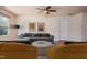 Staged room features wood floors, modern decor, a ceiling fan, and comfortable seating at 305 Wallington Ct, Mebane, NC 27302