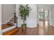 Elegant foyer showcases hardwood floors, staircase, and decorative trim at 312 Flint Point Ln, Holly Springs, NC 27540