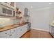 Gourmet kitchen with butcher block countertops, stainless steel appliances and custom cabinets at 312 Flint Point Ln, Holly Springs, NC 27540