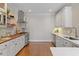 Gourmet kitchen with butcher block countertops, stainless steel appliances and custom cabinets at 312 Flint Point Ln, Holly Springs, NC 27540