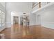 Open-concept living space with hardwood floors, view to kitchen, and soaring ceilings at 312 Flint Point Ln, Holly Springs, NC 27540