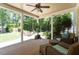 Cozy covered porch with comfortable seating, offering a relaxing view of the lush backyard at 312 Flint Point Ln, Holly Springs, NC 27540