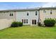 Backyard view shows the lush grass and neutral siding at 3215 Retama, New Hill, NC 27562