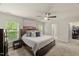 Inviting bedroom showcasing carpet, natural light, and an attached walk-in closet at 3215 Retama, New Hill, NC 27562
