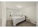 A cozy bedroom is naturally lit with neutral paint, carpet, and an exterior view at 3215 Retama, New Hill, NC 27562