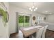 Cozy dining room features backyard views from a large sliding glass door and comfortable seating at 3215 Retama, New Hill, NC 27562