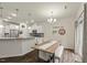 Open concept dining space next to the kitchen, with modern decor, a kitchen bar and island at 3215 Retama, New Hill, NC 27562