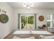Light-filled dining area with backyard access and view, alongside a charming decor at 3215 Retama, New Hill, NC 27562