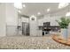 Bright kitchen featuring stainless steel appliances, granite countertops and white cabinetry at 3215 Retama, New Hill, NC 27562