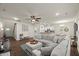 Spacious open floor plan featuring a comfortable sectional, dining area and sleek kitchen at 3215 Retama, New Hill, NC 27562