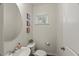 Well-lit powder room featuring a round mirror, vanity, and toilet at 3215 Retama, New Hill, NC 27562