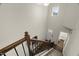 Wide staircase leading to the front door, with a view of the upstairs bathroom at 3215 Retama, New Hill, NC 27562
