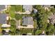 Aerial view of the home showcasing lush landscaping and mature trees in a desirable neighborhood at 3306 Storybook Ln, Raleigh, NC 27614