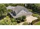 Aerial view of the home showing three-car garage, landscaped yard, and mature trees at 3306 Storybook Ln, Raleigh, NC 27614