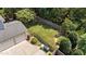 A spacious backyard with a wooden fence and a three-car garage at 3306 Storybook Ln, Raleigh, NC 27614