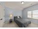 Cozy bedroom featuring a full-sized bed, neutral walls, and natural light from the window at 3306 Storybook Ln, Raleigh, NC 27614