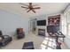 Inviting bonus room featuring a fireplace, tv, ceiling fan, and comfortable seating at 3306 Storybook Ln, Raleigh, NC 27614