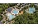 Aerial view of community amenities with pool, tennis, playground, and clubhouse at 3306 Storybook Ln, Raleigh, NC 27614